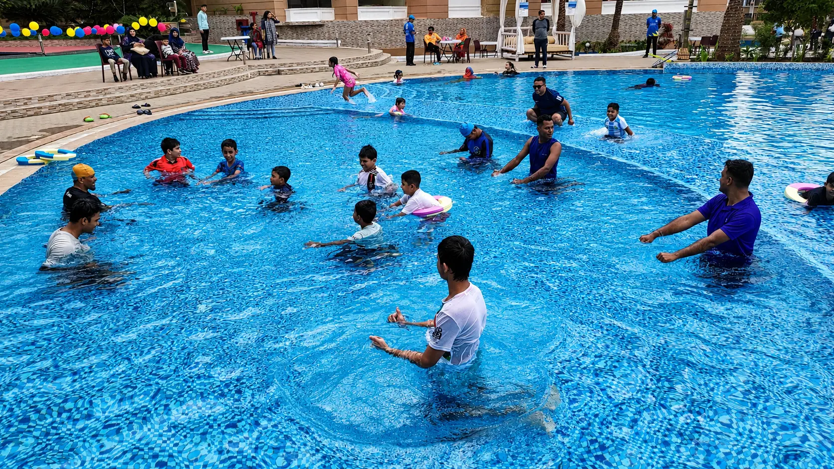 Guests enjoying a lively game in the resort pool